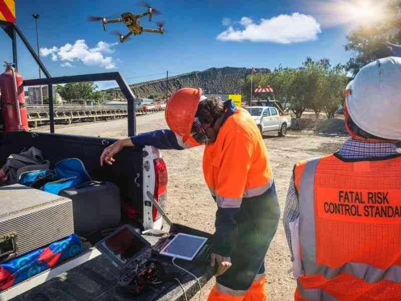 Drone LiDAR crew scanning a large development tract to collect terrain data for site review and planning