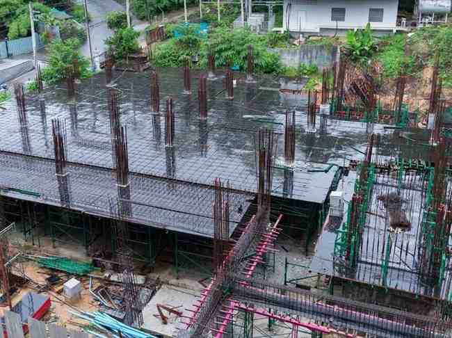 Wet construction site with standing water showing why topographic survey review is needed before stormwater grading