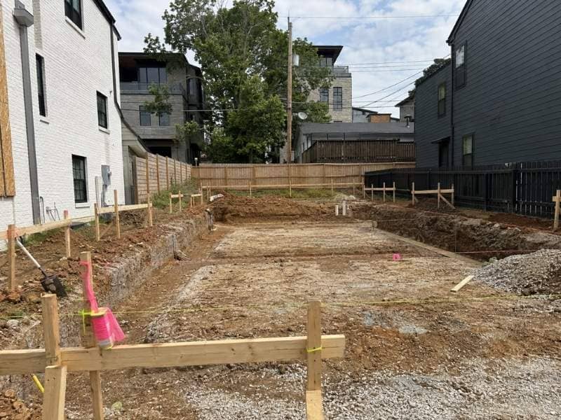 Construction Staking layout stakes and string lines marking a small building lot in Nashville Tennessee.